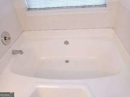 a bathroom with a bathtub
