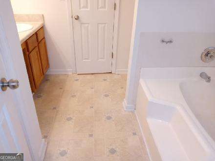 636 Rayella Drive Stockbridge, GA 30281 - Photo 2 of 13 a bathroom with a bathtub