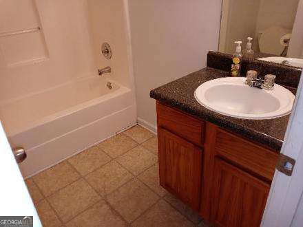 636 Rayella Drive Stockbridge, GA 30281 - Photo 9 of 13 a bathroom with a sink and a bathtub