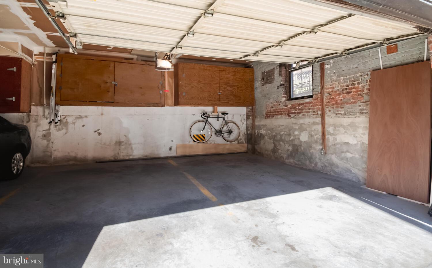 1840 California Street Northwest, Unit 2A Washington, DC 20009 - Photo 23 of 26 Garage Parking on Left Side + Storage Cabinet