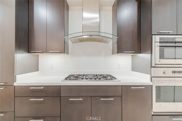 a kitchen with a stove and a refrigerator