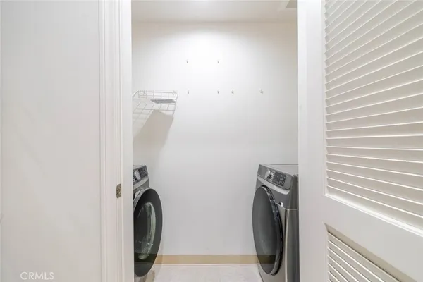 a bathroom with a sink and a washer