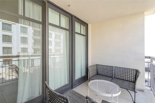a view of a hallway with toilet and a window