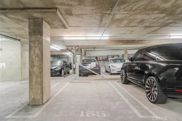 a view of parking garage with cars