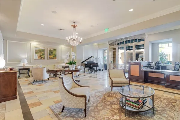 a living room with fireplace furniture and a large window