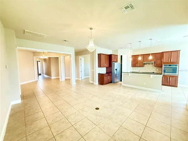 a view of a electric appliances in kitchen and a glass door