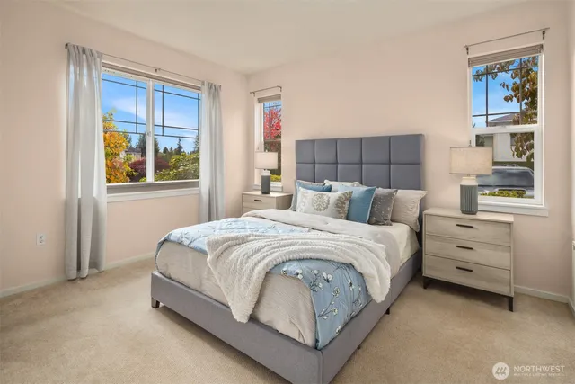 a bedroom with a bed and window