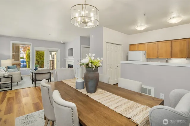a dining room with furniture and wooden floor