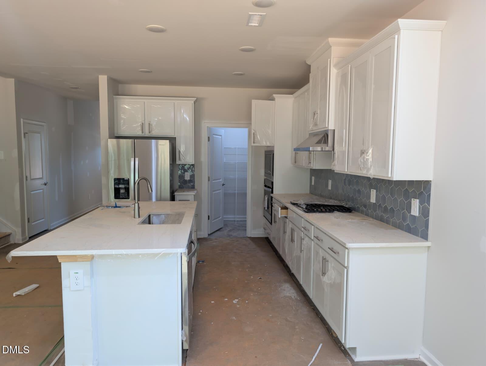 308 Karlov Road Garner, NC 27529 - Photo 5 of 55 a kitchen with a sink stove and refrigerator