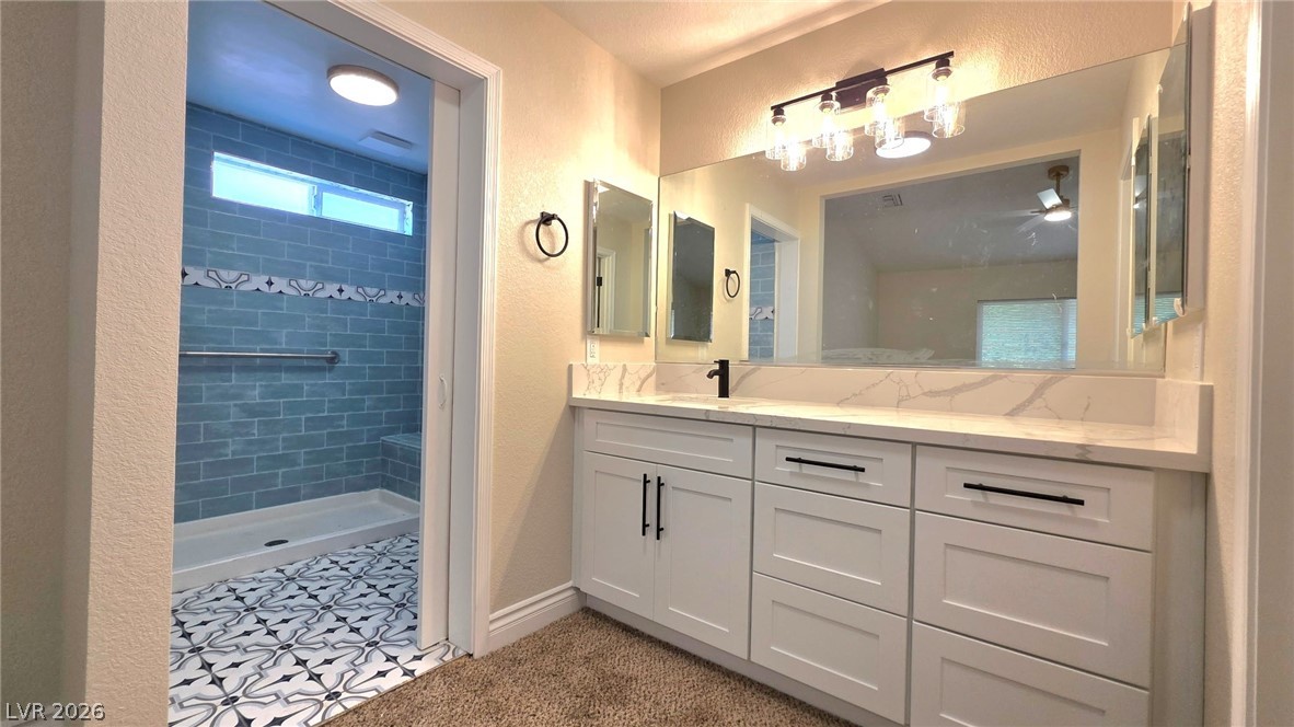 2155 Athol Way Laughlin, NV 89029 - Photo 10 of 19 A well-appointed bathroom offers a vanity with ample counter space and a refreshing walk-in shower.
