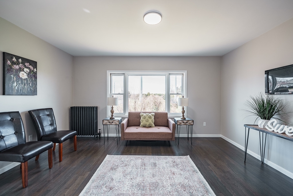 10 Bill Street Chicopee, MA 01013 - Photo 11 of 41 a living room with furniture and a large window