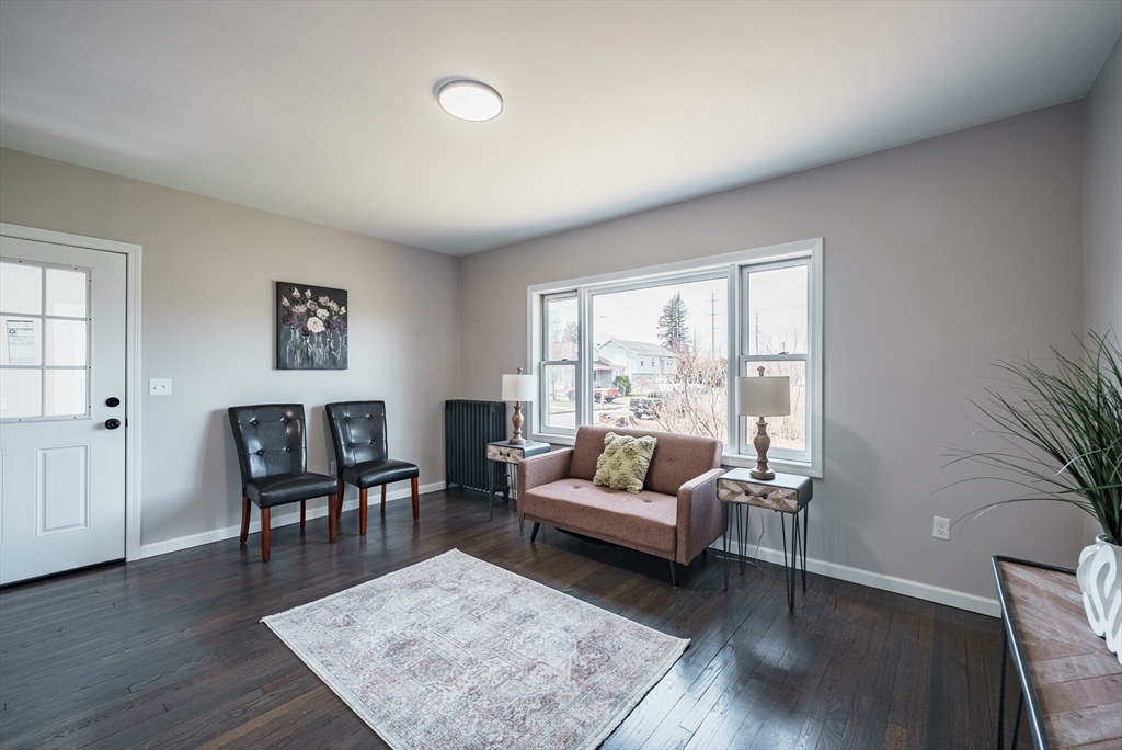 10 Bill Street Chicopee, MA 01013 - Photo 12 of 41 a living room with furniture wooden floor and a rug