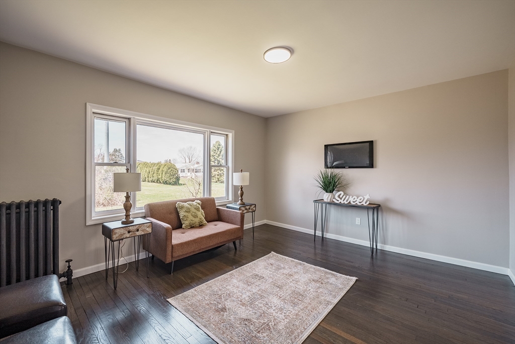 10 Bill Street Chicopee, MA 01013 - Photo 15 of 41 a living room with furniture and a large window
