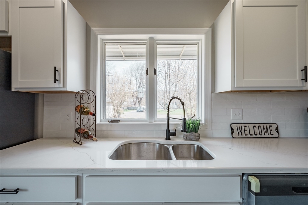 10 Bill Street Chicopee, MA 01013 - Photo 17 of 41 a kitchen with a sink and cabinets