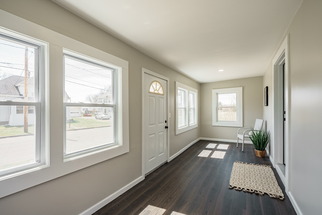 10 Bill Street Chicopee, MA 01013 - Photo 2 of 41 a view of livingroom with hardwood floor and window