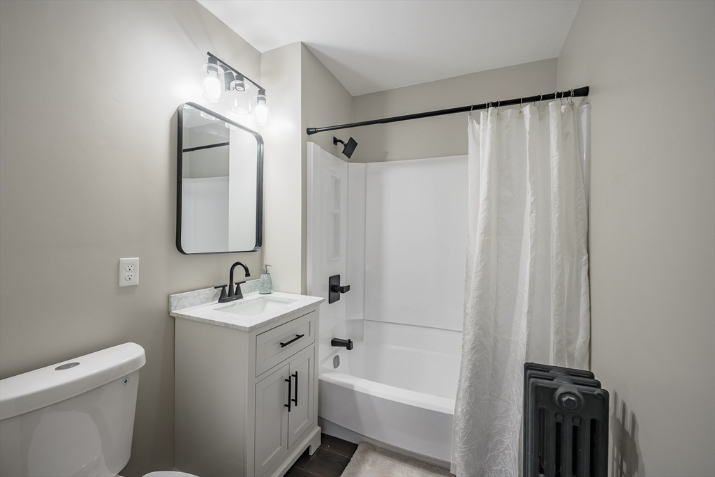 10 Bill Street Chicopee, MA 01013 - Photo 21 of 41 a bathroom with a toilet a sink and a bathtub