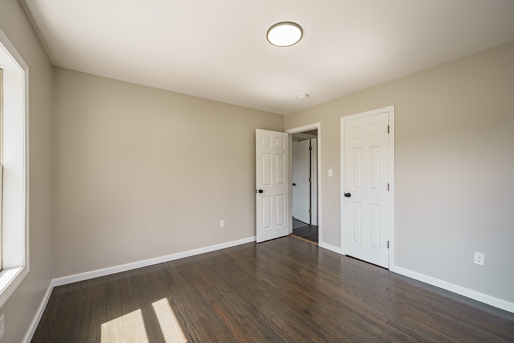 10 Bill Street Chicopee, MA 01013 - Photo 30 of 41 an empty room with wooden floor and windows