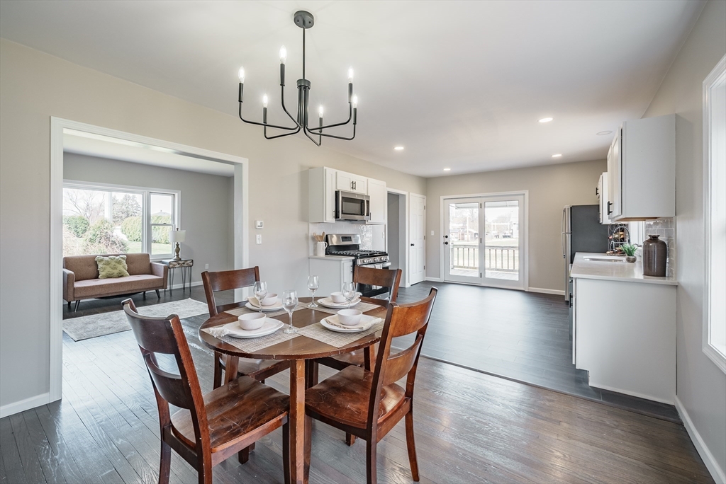 10 Bill Street Chicopee, MA 01013 - Photo 3 of 41 a view of a dining room with furniture window and wooden floor