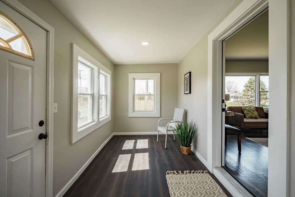 10 Bill Street Chicopee, MA 01013 - Photo 31 of 41 a hallway with wooden floor and a potted plant