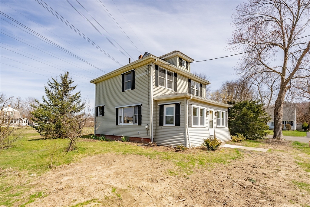 10 Bill Street Chicopee, MA 01013 - Photo 33 of 41 a house that has a tree in front of it