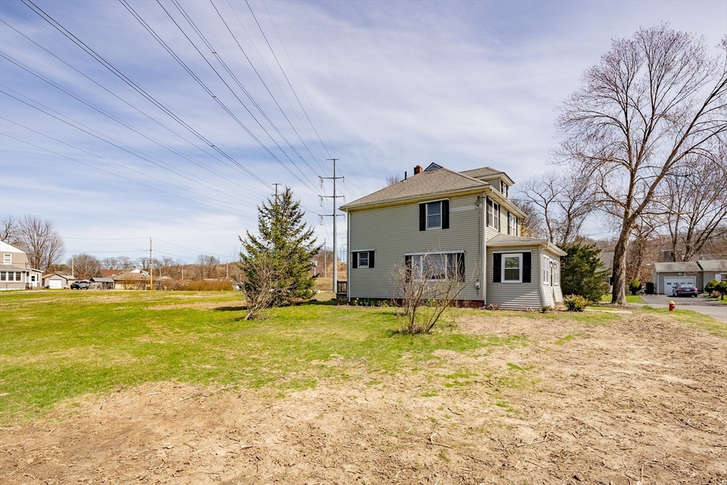 10 Bill Street Chicopee, MA 01013 - Photo 34 of 41 a house that has a big yard with a large trees