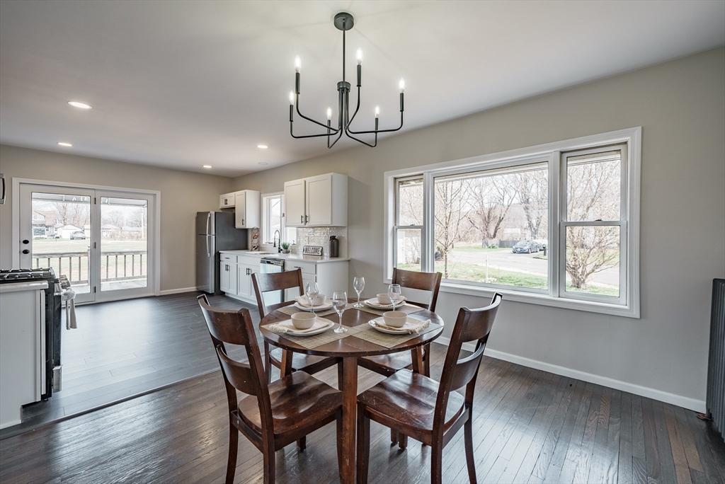 10 Bill Street Chicopee, MA 01013 - Photo 4 of 41 a view of a dining room with furniture window and wooden floor