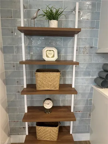 a table with a stove and a wooden floor