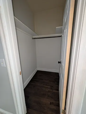 a view of an empty walk in closet