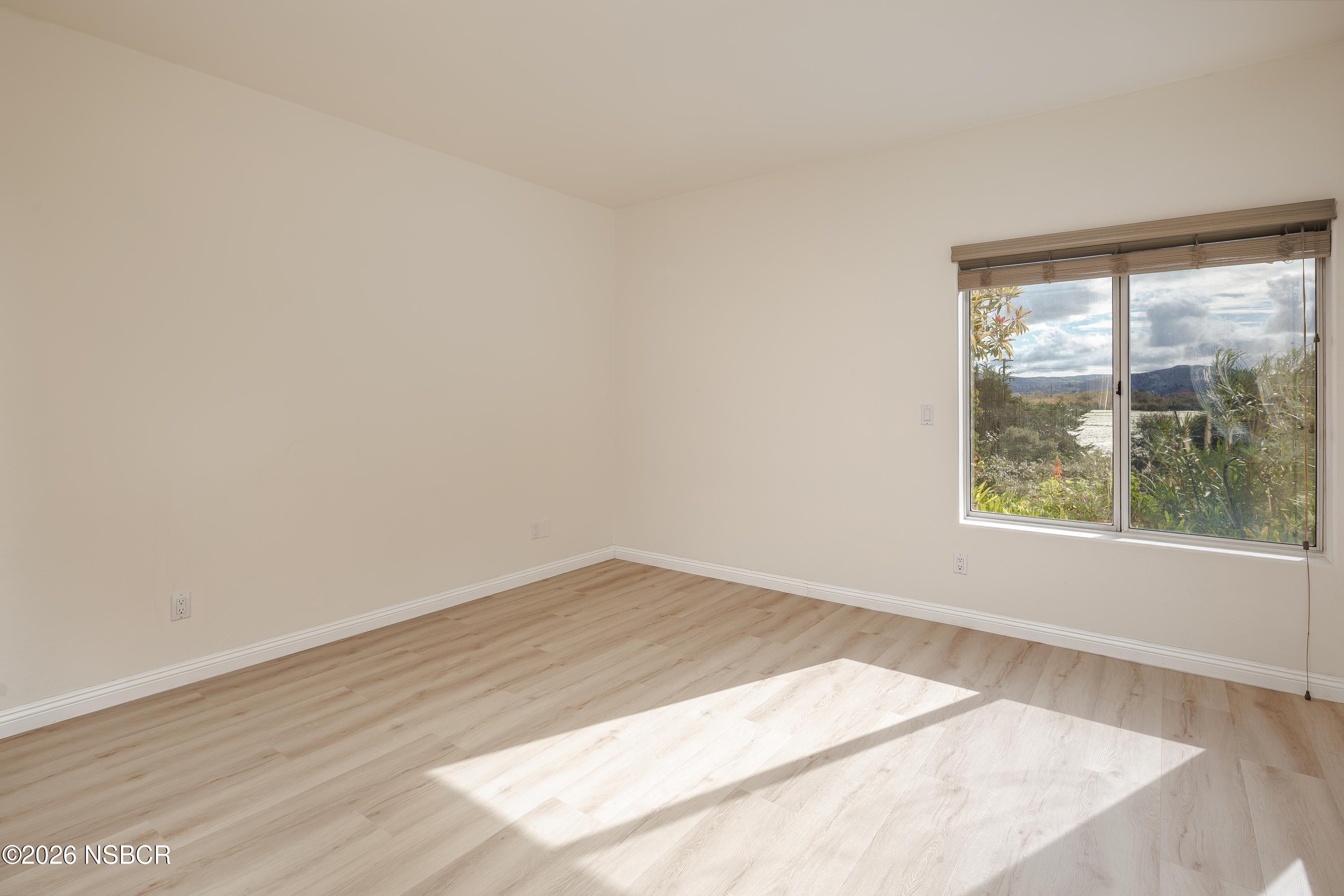 2655 Adobe Falls Road Lompoc, CA 93436 - Photo 33 of 51 an empty room with wooden floor and windows