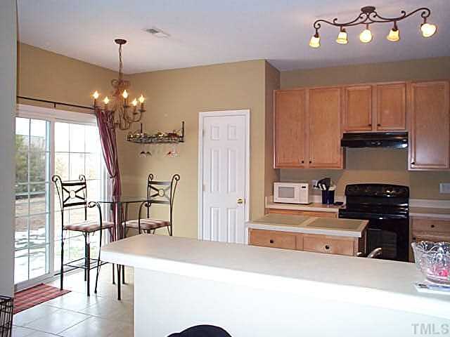 5331 Seaspray Lane Raleigh, NC 27610 - Photo 3 of 12 Large kitchen with breakfast area and breakfast bar and center island