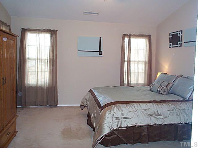 5331 Seaspray Lane Raleigh, NC 27610 - Photo 7 of 12 Master bedroom with cathedral ceiling and lots of windows