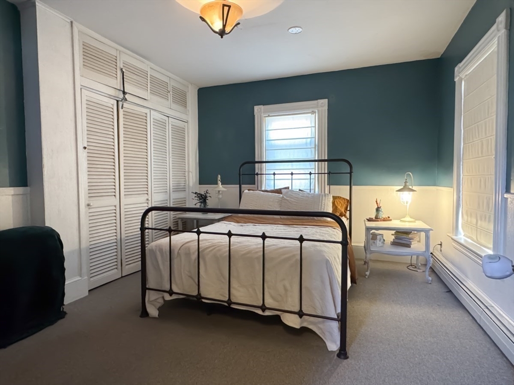 83 Newton Street Greenfield, MA 01301 - Photo 19 of 42 a bedroom with a bed and a window