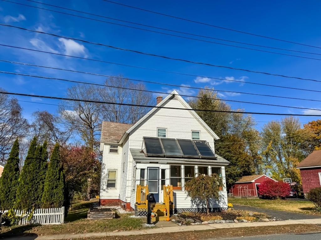 83 Newton Street Greenfield, MA 01301 - Photo 2 of 42 a front view of a house with garden