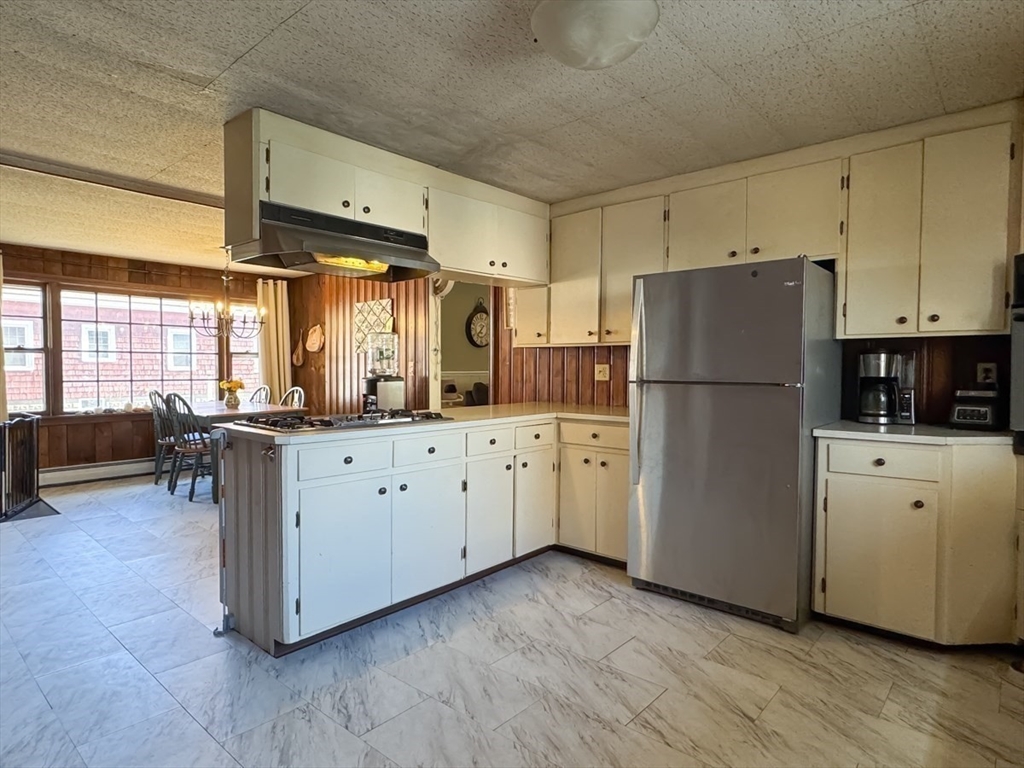 83 Newton Street Greenfield, MA 01301 - Photo 7 of 42 a kitchen with refrigerator and window