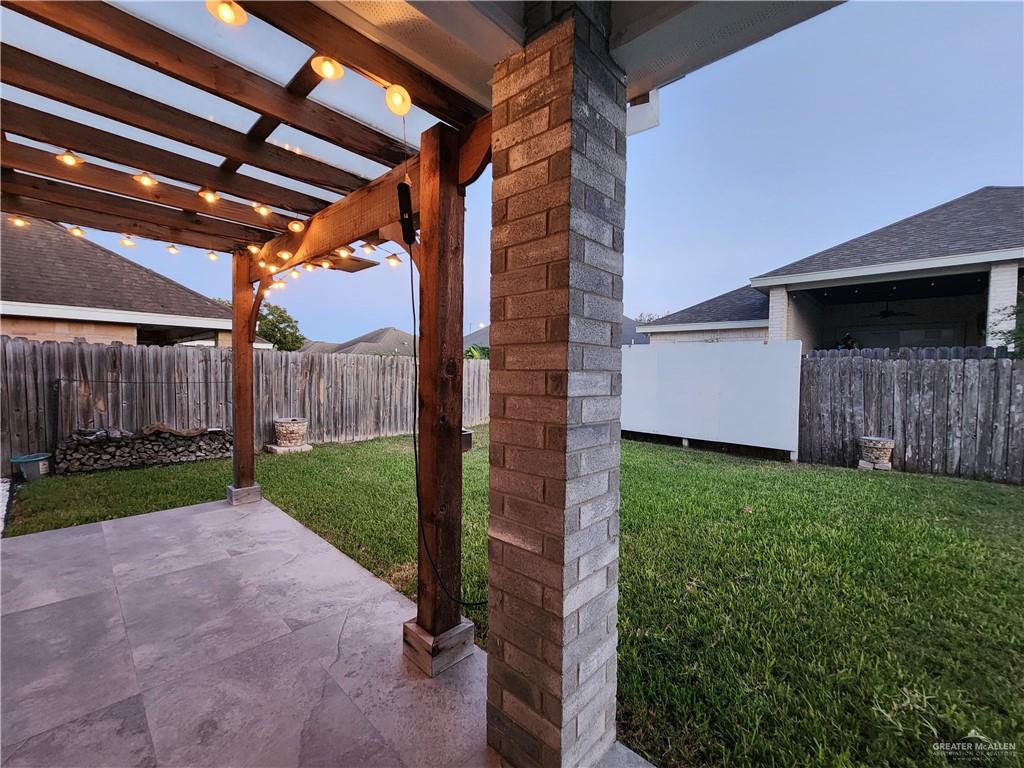2821 Grayson Avenue McAllen, TX 78504 - Photo 11 of 31 a view of backyard with potted plants and wooden fence