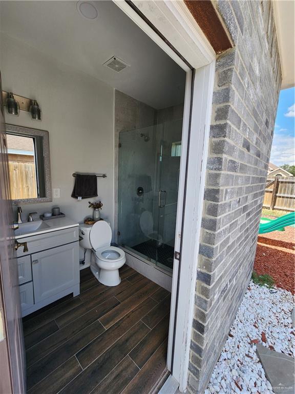 2821 Grayson Avenue McAllen, TX 78504 - Photo 14 of 31 a bathroom with a granite countertop sink toilet and shower