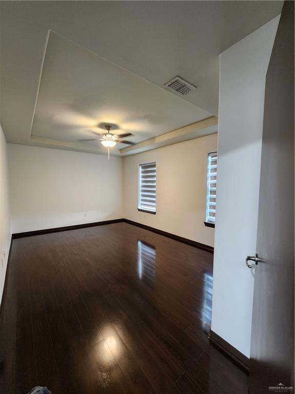 2821 Grayson Avenue McAllen, TX 78504 - Photo 28 of 31 an empty room with wooden floor and windows