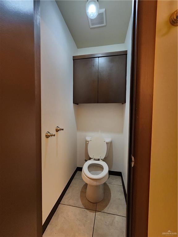 2821 Grayson Avenue McAllen, TX 78504 - Photo 30 of 31 a bathroom with a toilet and a shower