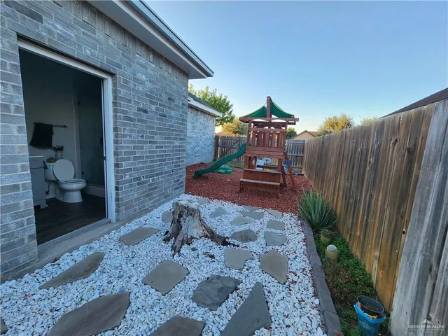 a view of a backyard with furniture