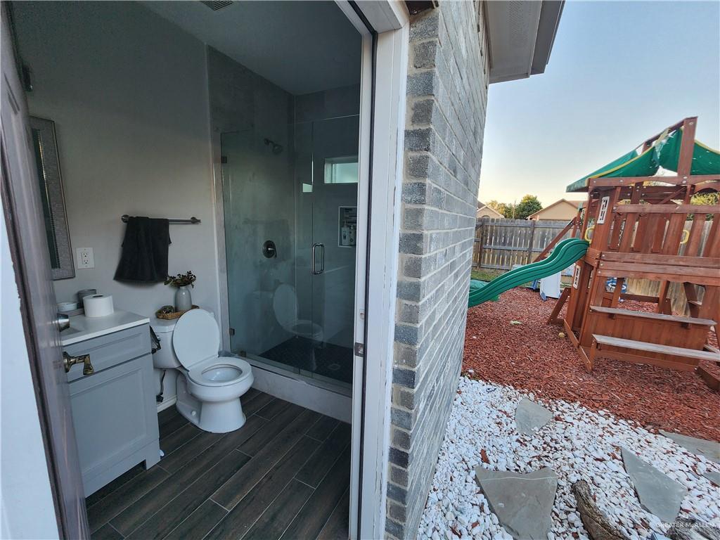 2821 Grayson Avenue McAllen, TX 78504 - Photo 5 of 31 a bathroom with a toilet and a shower