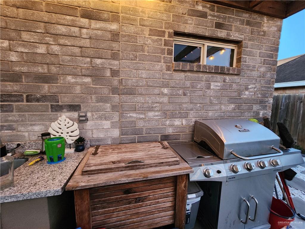 2821 Grayson Avenue McAllen, TX 78504 - Photo 7 of 31 a stove top oven sitting inside of a kitchen