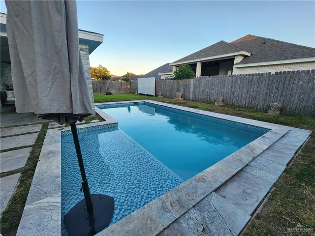 a view of a backyard with sitting area