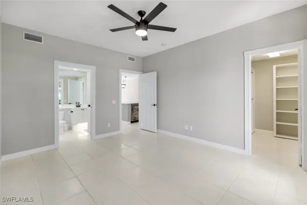 a view of an empty room and fire place