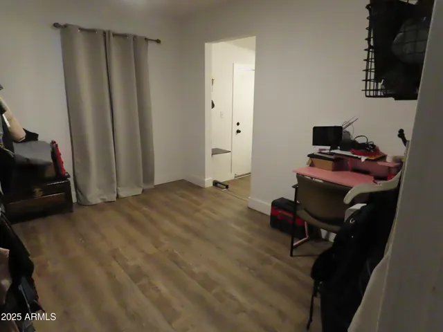 a bedroom with a workspace