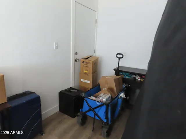 a room with furniture wall paintings and a window