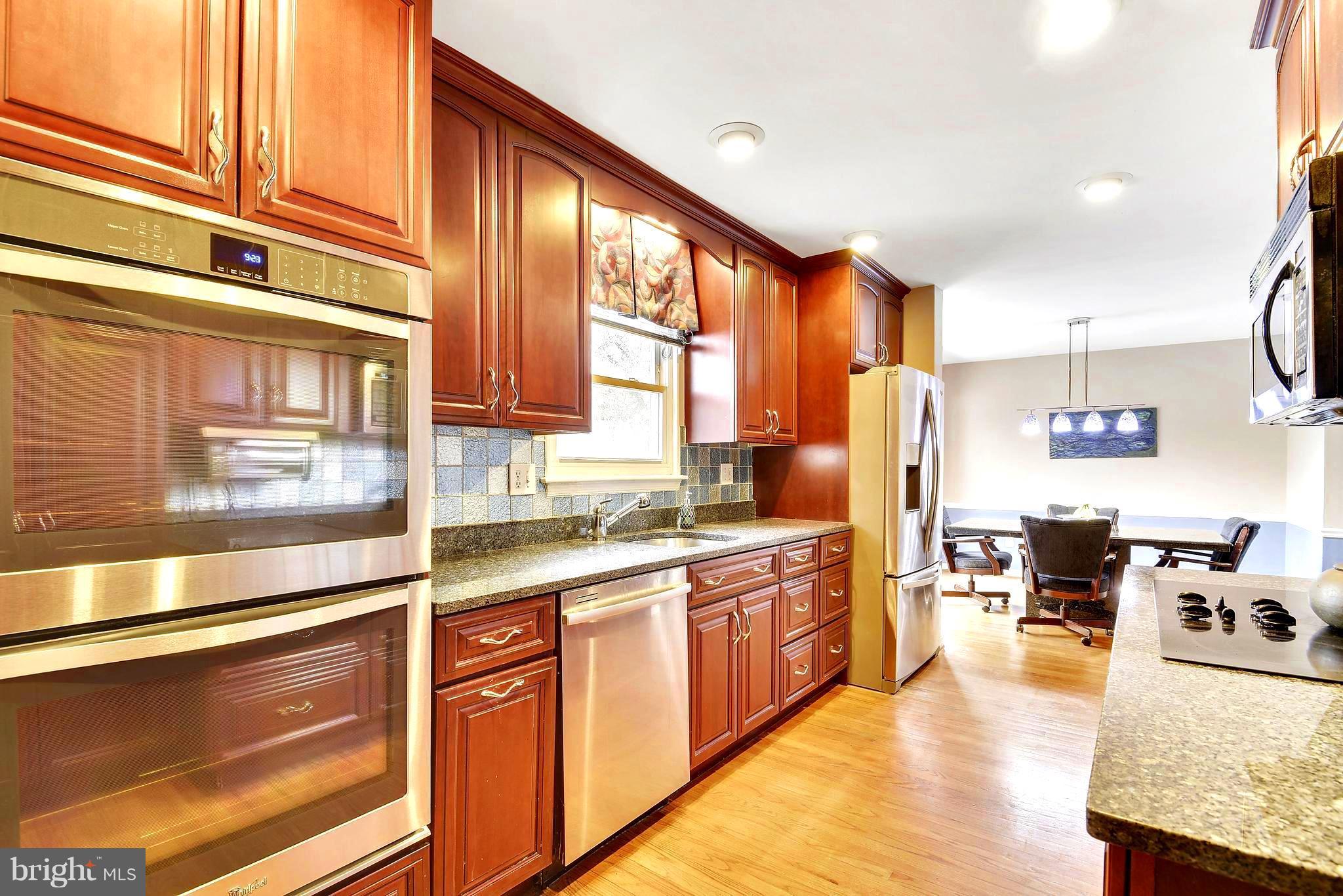 15033 Joshua Tree Road Gaithersburg, MD 20878 - Photo 6 of 28 Stainless steel appliances and granite countertops