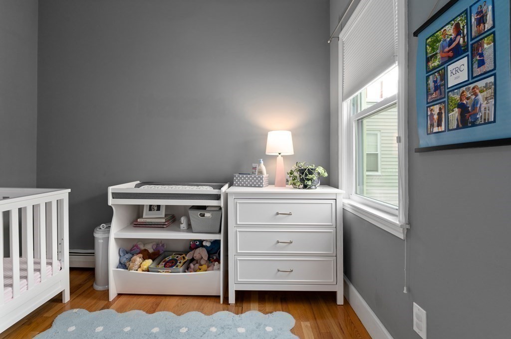 8 Sheafe Street, Unit 1 Boston, MA 02129 - Photo 12 of 19 a bedroom with a baby bed and a window