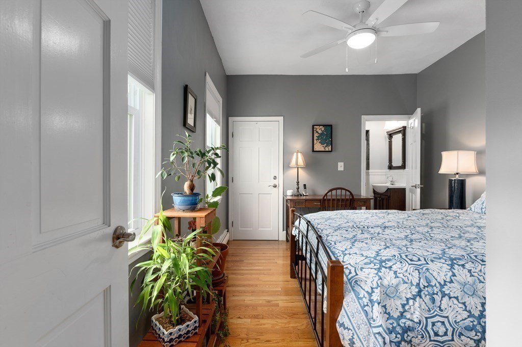 8 Sheafe Street, Unit 1 Boston, MA 02129 - Photo 14 of 19 a living room with a bed and a chandelier