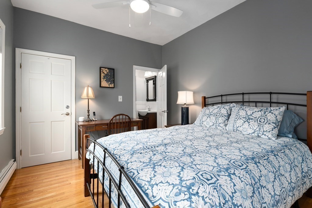 8 Sheafe Street, Unit 1 Boston, MA 02129 - Photo 15 of 19 a bedroom with a bed and wooden floor