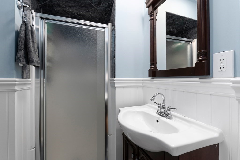 8 Sheafe Street, Unit 1 Boston, MA 02129 - Photo 16 of 19 a bathroom with a sink and a mirror